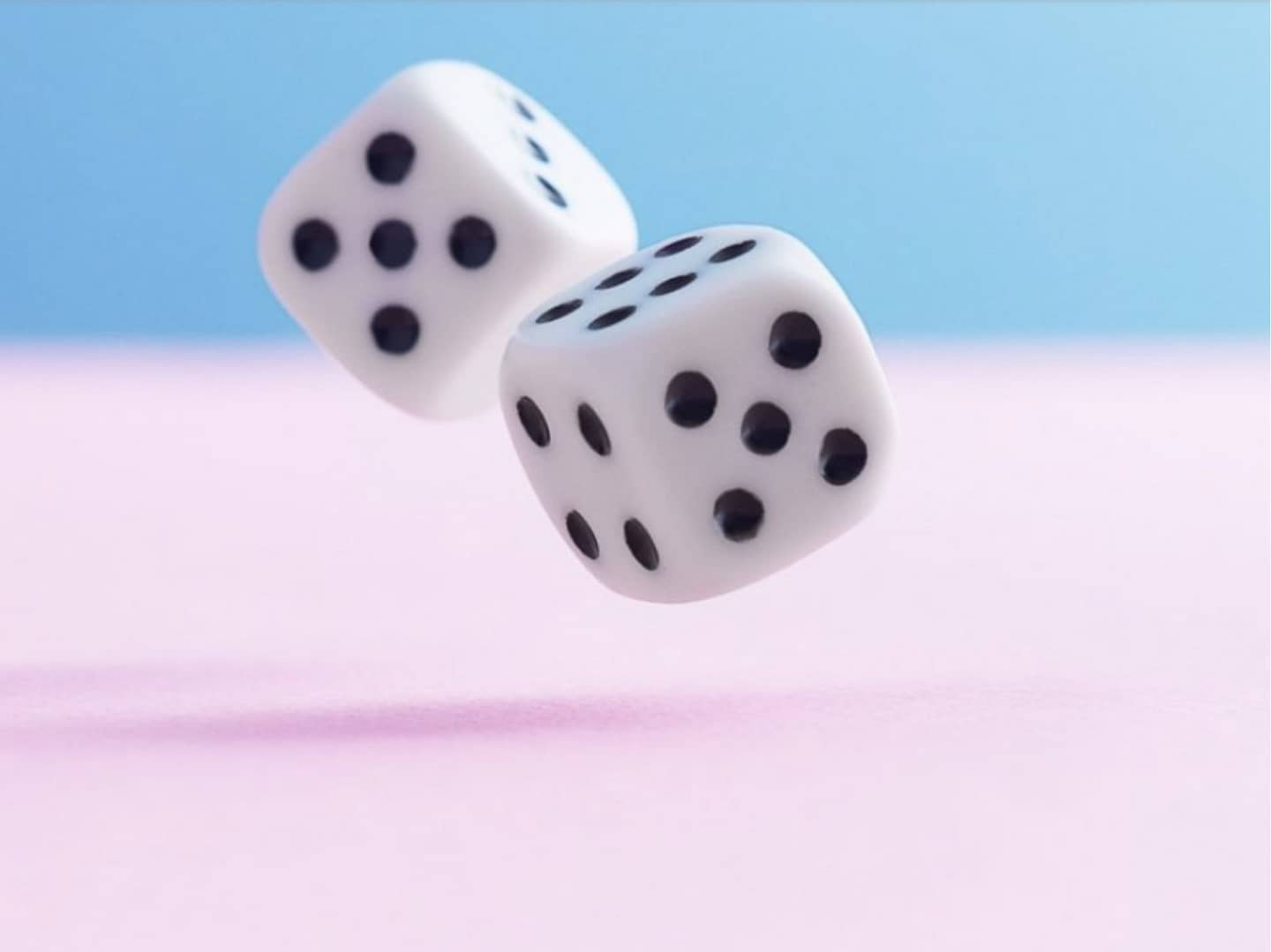 Two White Dices With a Light Blue Background